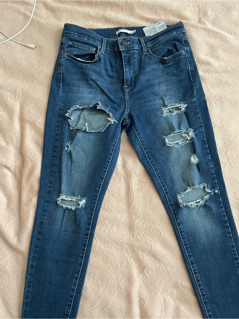 Levi’s 710 skinny distress jeans